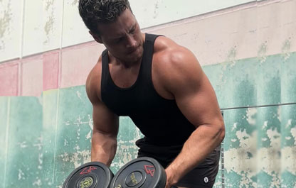 Coach Connor training with dumbbells