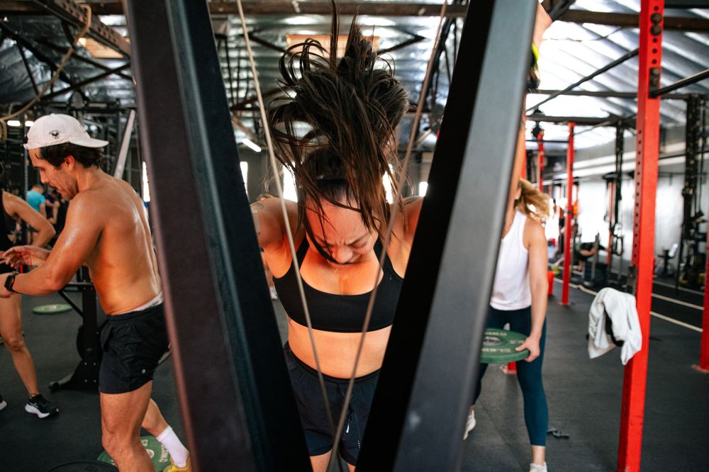Athletes training hard during a busy Ganbatte class